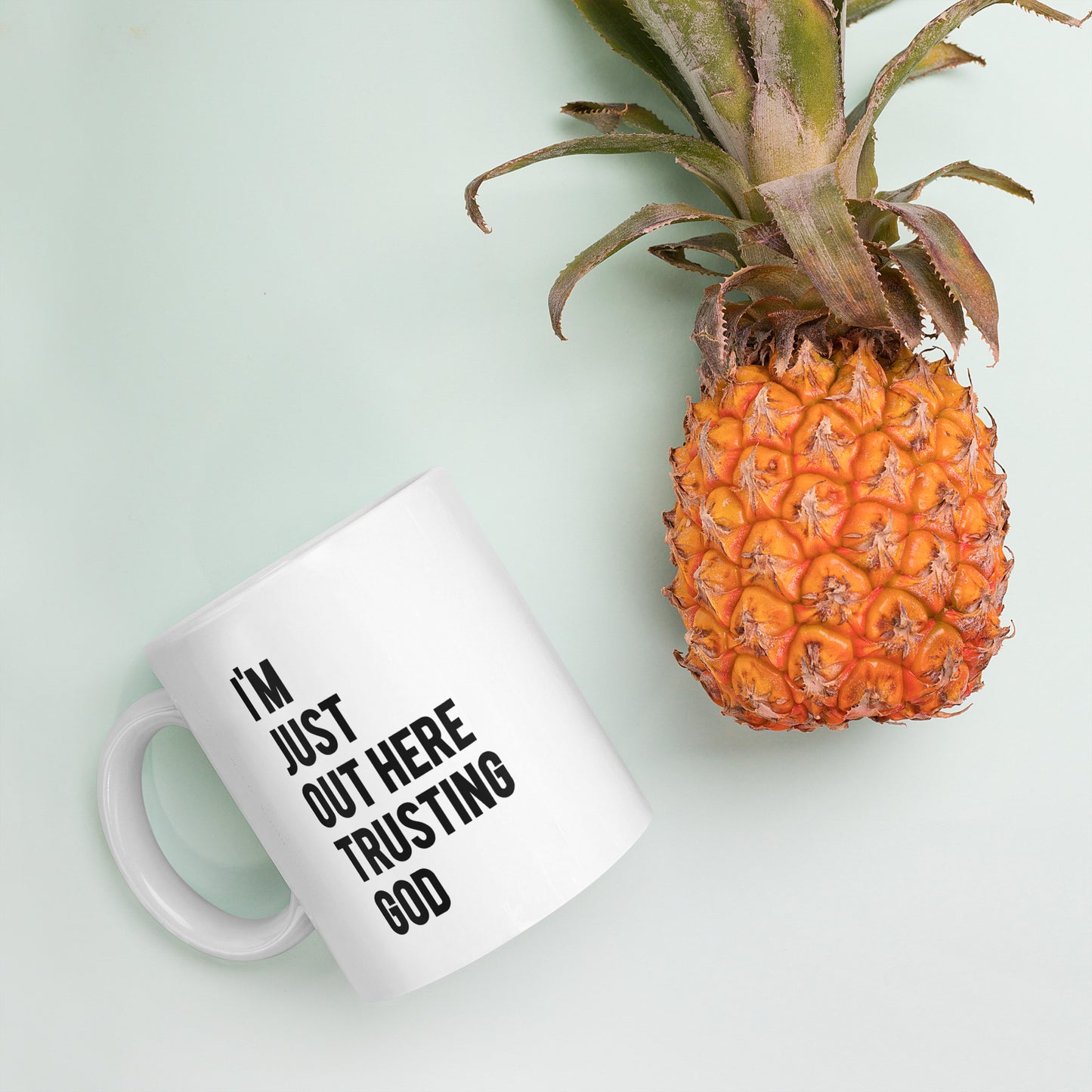 "I'm Just Out Here Trusting God" White glossy mug